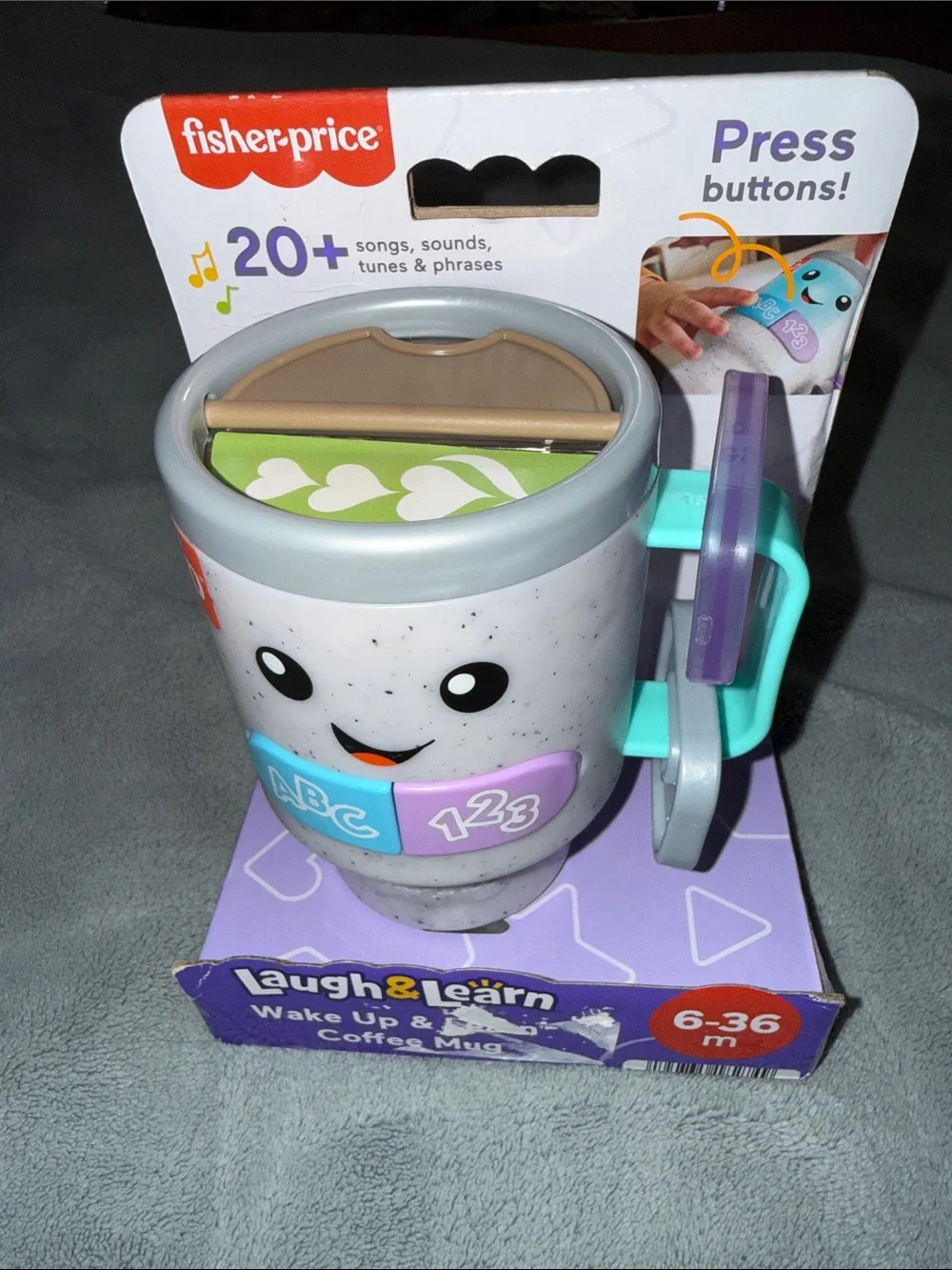 Fisher-Price Laugh & Learn Light-Up Learning Mug in Blue, Purple, Teal, Gray